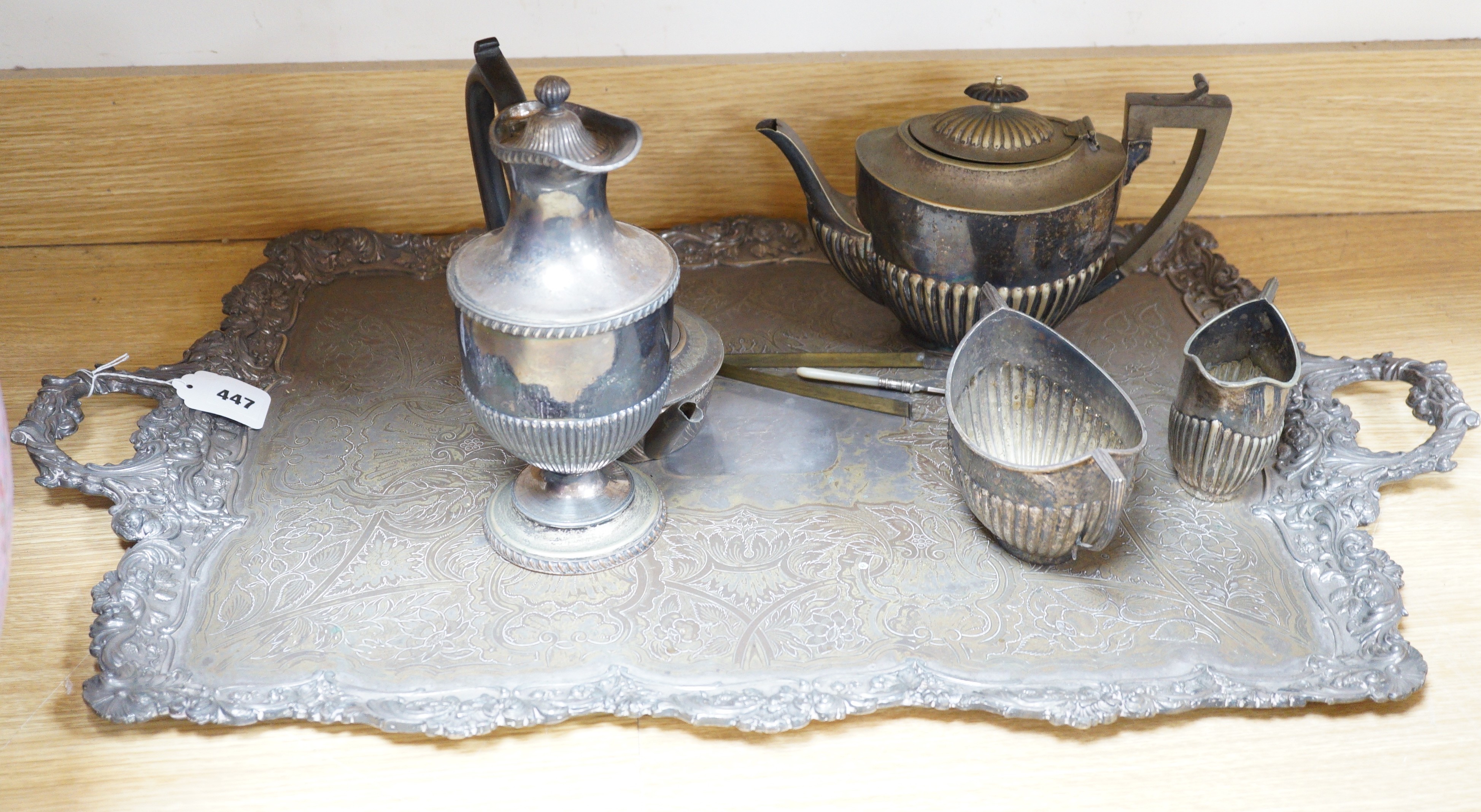 A silver plated two handled tea tray and seven other plated items, tray length 80cm